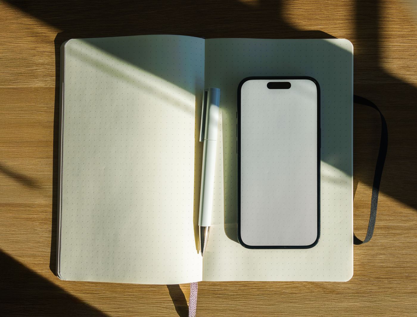 A quiet, sunlit desk with a notebook ready for planning.