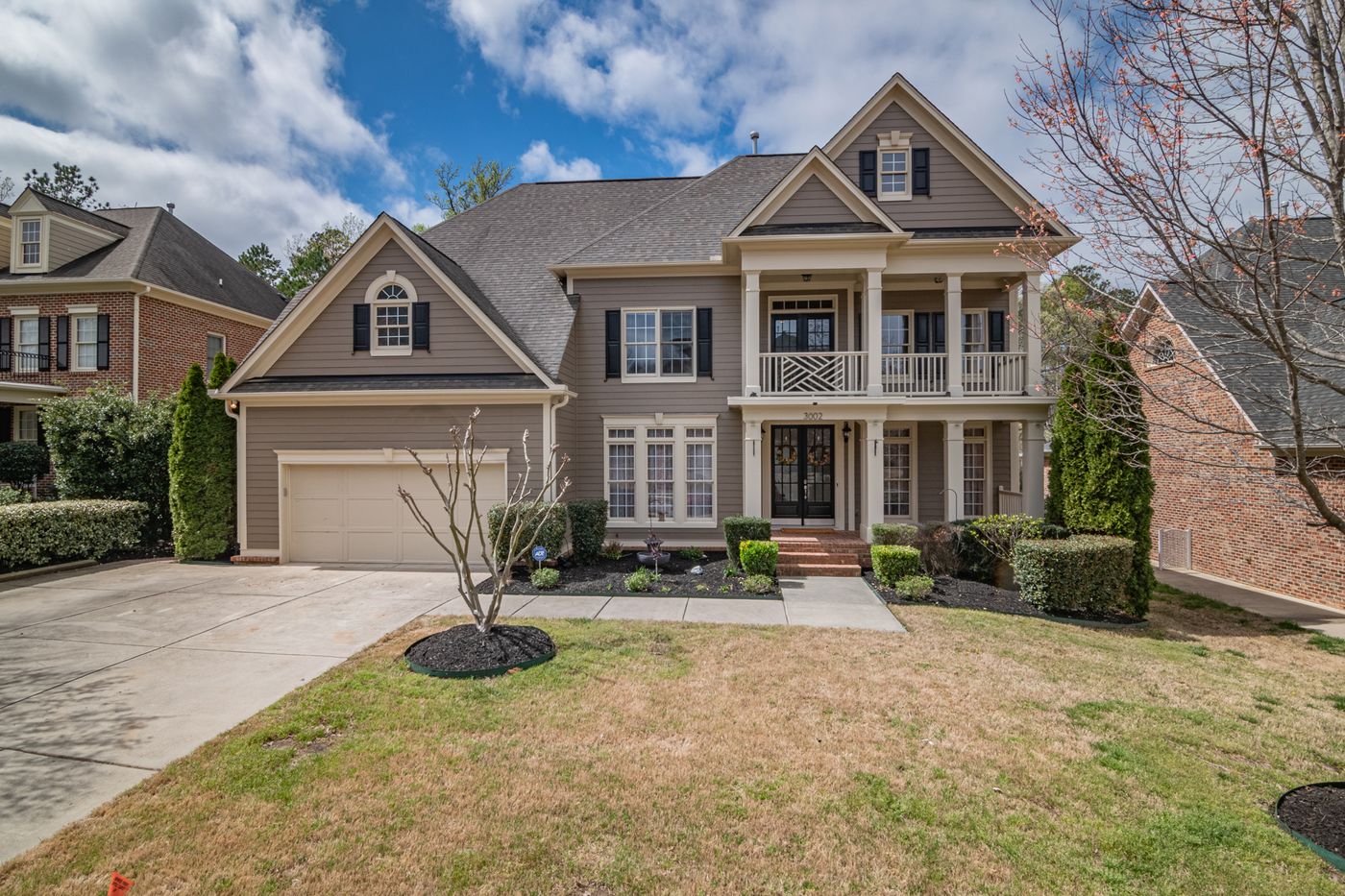Stock exterior photography illustrating a fictional open-house invitation.